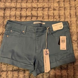 Never worn tags still attached. Blue celebrity pink size 11.